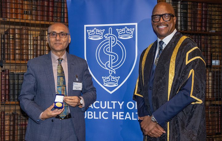 Prof Anjum Memon receiving an award