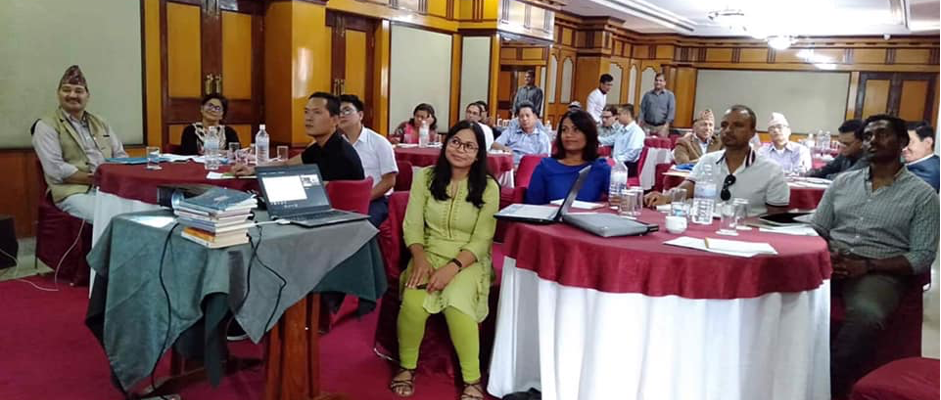 A group of researchers sitting in a conference