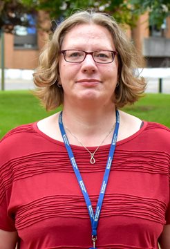 A head and shoulders photo of Grit Gansch from BSMS, taken outside in front of grass and a building